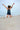 Beach jumping in Tribal Chakra Ocean Breeze Racerback Tank Dress